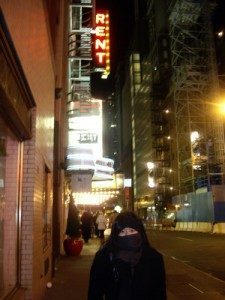Me in front of the Nederlander Theatre, all rugged up in a fleece ear warmer/headband, wool scarf, gloves and overcoat.