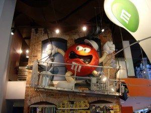 A very angry looking Red dressed as a high rise window cleaner with a very large pigeon.